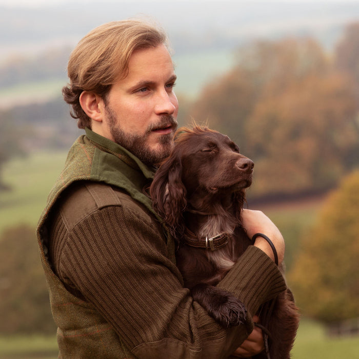 Man with Springer Spaniel in his arms